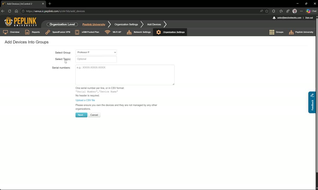 Add devices at the org level — enter serials and choose the destination group.
